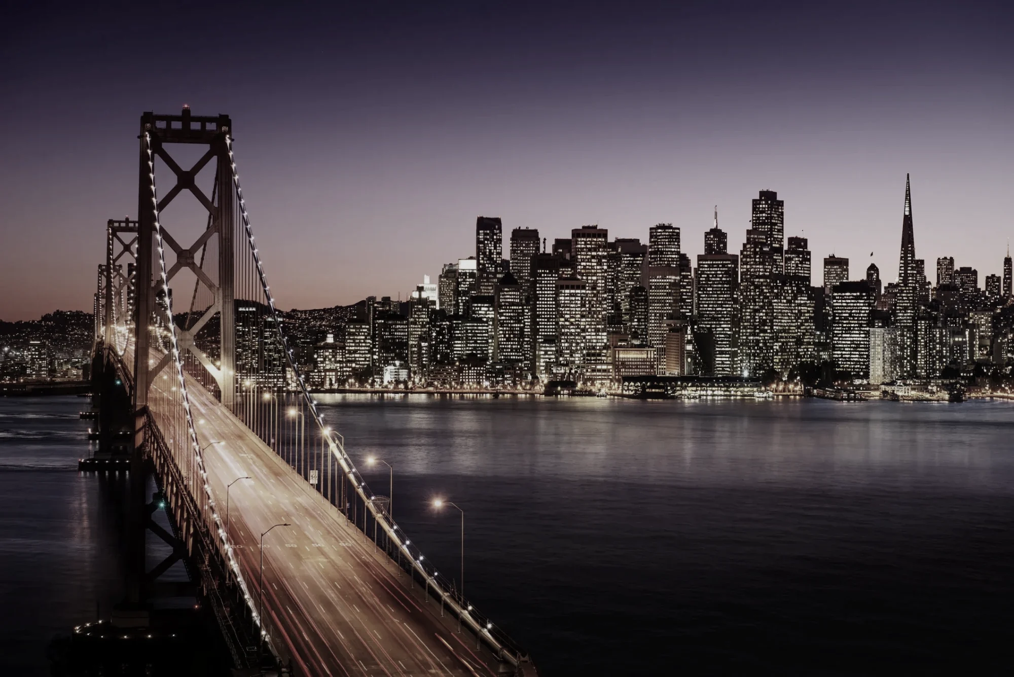 The Bay Bridge and the San Francisco skyline at dusk